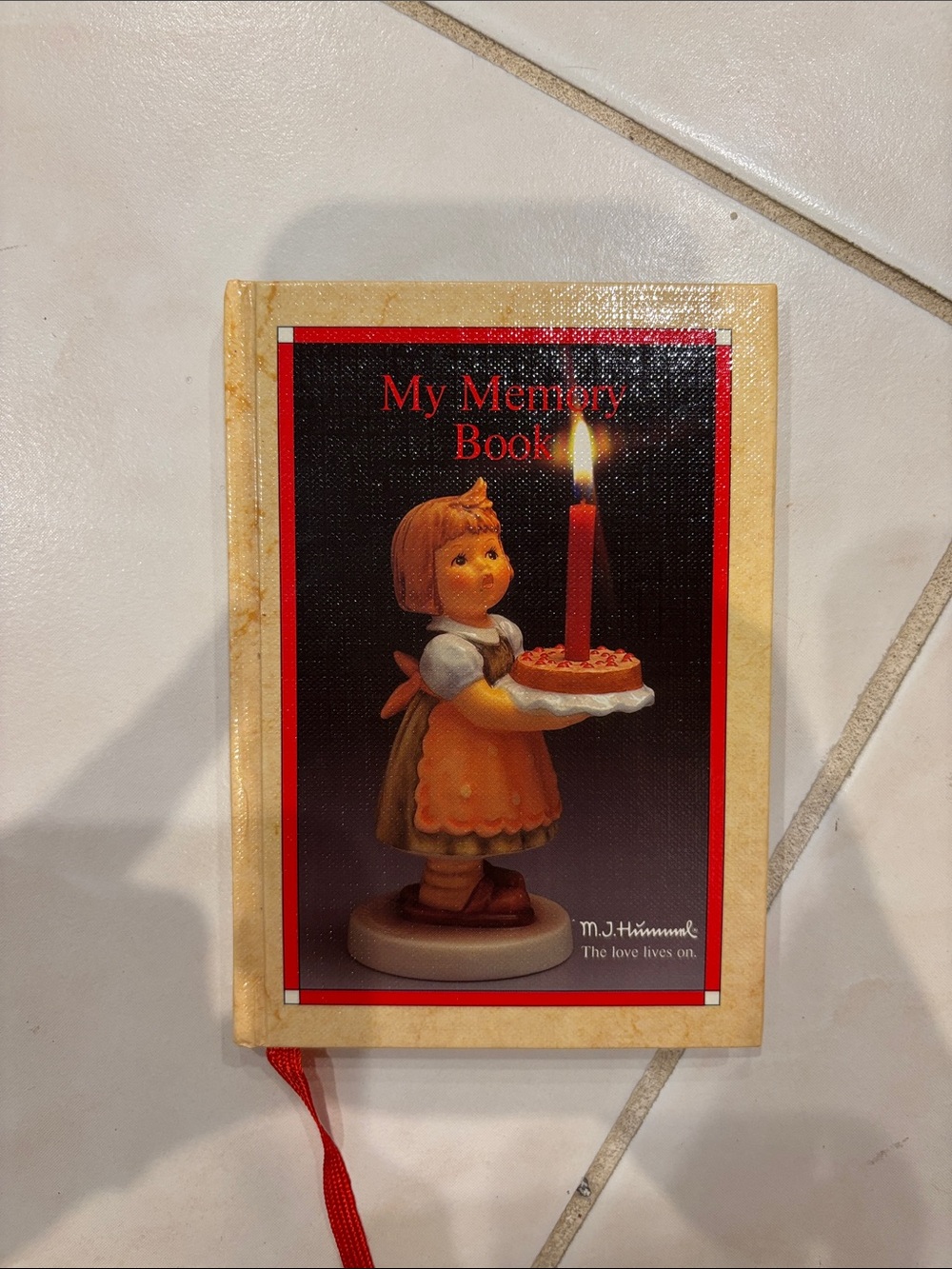 Hummel Cream Book with Red Candle Artwork